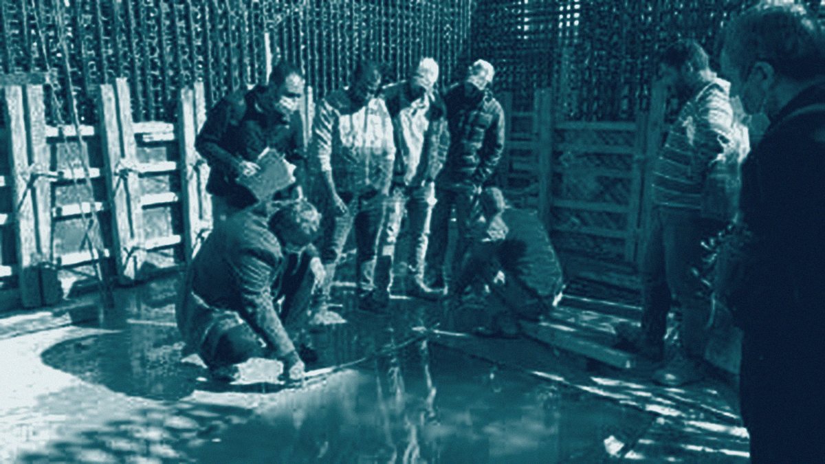 Engineers reviewing drawings with the site team on a construction site.